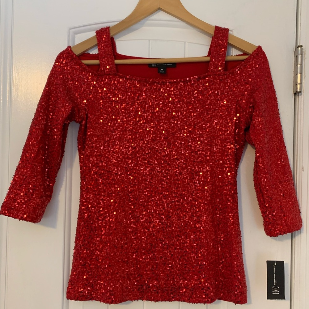 INC sequined red top with cut out shoulders. Size PP.